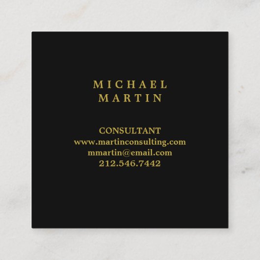 モノグラムが付いているエレガントな黒および金ゴールドの月桂樹のリース スクエア名刺 (裏面)