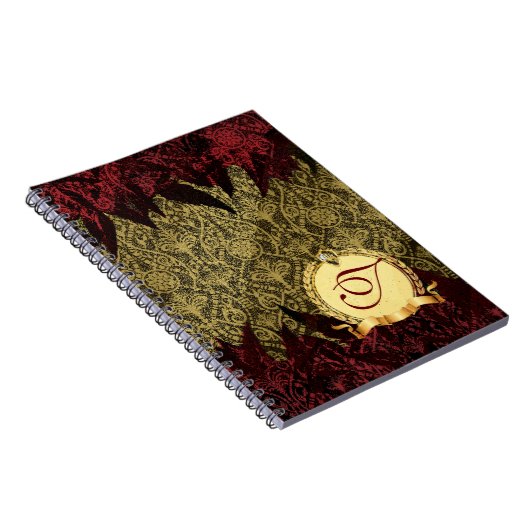 モノグラムとのファンシーでグランジなダマスク織の金ゴールドそして赤 ノートブック (右側)