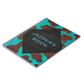 モノグラムカウブラウンおよびティール(緑がかった色)プリント ノートブック (左側)