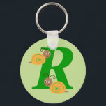 モノグラム文字R brian the snail kids keychain キーホルダー<br><div class="desc">モノグラムイニシャルレターR brianカタツムリの漫画の子供や子供のキーチェーン/キーリング。女の子と男の子のための理想的な贈り物またはプレゼント</div>