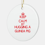 モルモットを抱き締めることによって平静を保って下さい セラミックオーナメント (左)