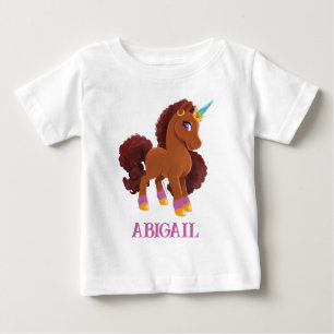 ユニッユニークコーン立ち誇りを持った ベビーTシャツ