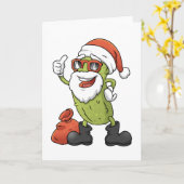 ユーモアたっぷりのピクルスサンタクロースのクリスマス漫画 カード (黄色い花)
