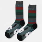 ユーモラスなトルコブルーグレーの「Fleece Navidad」ラマ ソックス (左)