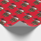 ヨークシャーテリアのパピーはサンタクロースの帽子をかぶっている ラッピングペーパー (角)