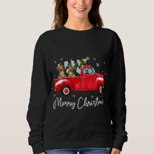 ヨークシャーテリアレッドトラッククリスマスサンタハットドッグクリスマス スウェットシャツ