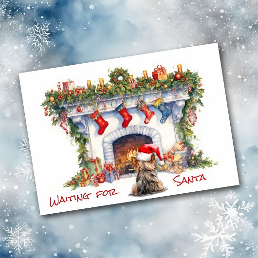 ヨークシャーテリア犬がサンタ・クリスマス暖炉を待つ