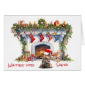 ヨークシャーテリア犬がサンタ・クリスマス暖炉を待つ (正面横)