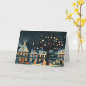 ライトアップされたクリスマスツリーと雪の多い家 カード (黄色い花)