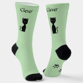 ライトグリーンの背景にかわいい黒猫と前足 ソックス