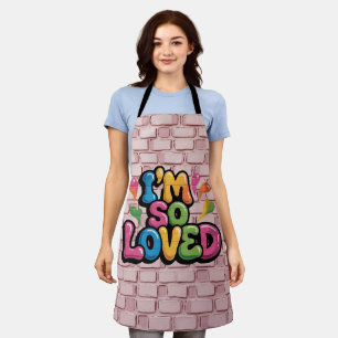 ライトピンクのレンガの"I'm So Loved Graffiti"タグ エプロン