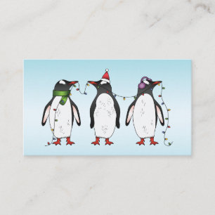 ライトブルーの背景の3羽のクリスマス・ペンギン 名刺