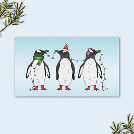 ライトブルーの背景の3羽のクリスマス・ペンギン 名刺