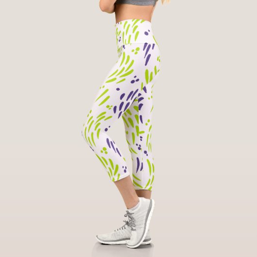 ライムグリーンと紫の流れ カプリレギンス (左)