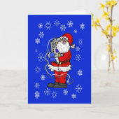 ラジオのクリスマスカードを抱きしめるサンタ カード (黄色い花)