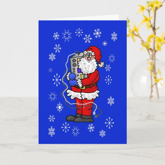 ラジオのクリスマスカードを抱きしめるサンタ カード (黄色い花)