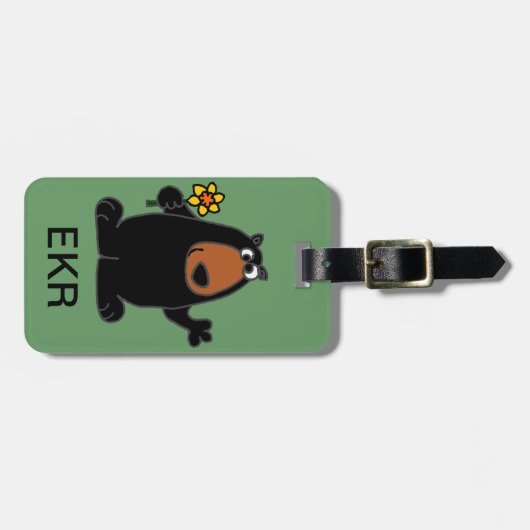 ラッパスイセンの漫画を持つかわいいツキノワグマ ラゲッジタグ (正面横)