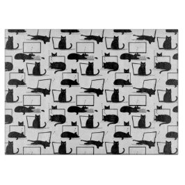 ラップトップに座っている黒猫のパターン カッティングボード