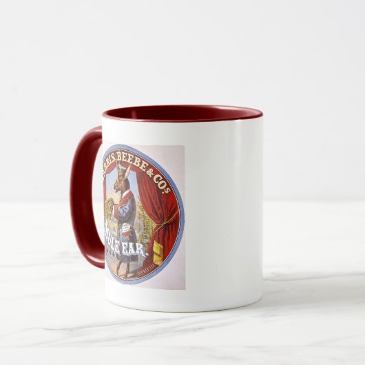 ラバの耳のタバコの広告のヴィンテージ1868年 マグカップ (正面左)