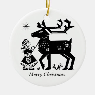 ラプランドの女の子はトナカイのクリスマスの装飾を握ります セラミックオーナメント