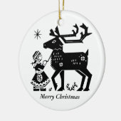 ラプランドの女の子はトナカイのクリスマスの装飾を握ります セラミックオーナメント (左)
