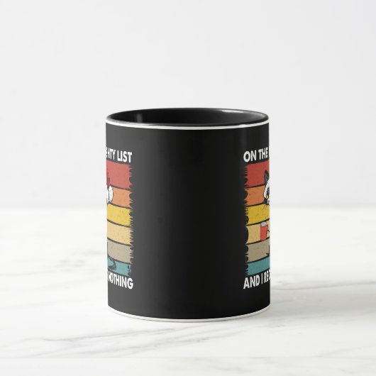 リストに載った不機嫌なクリスマスいけなネコ マグカップ (中央)