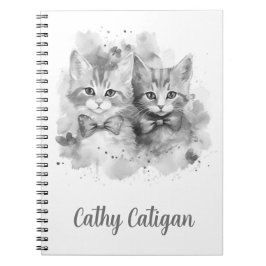 リボンが付いた黒と白の子猫たちにカスタム名 ノートブック