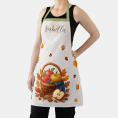 リンゴとが入った秋離れの収穫籠 エプロン (インサイチュ)