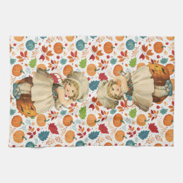 リンゴを彫る少女とカラフルなカボチャのハロウィーン キッチンタオル