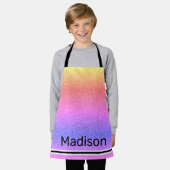 レイガーリーンボーグリッターが輝くパーソナライズされた子ども エプロン (着用した状態)