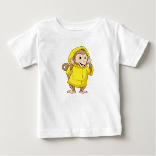 レインコートで雨が降っているサル ベビーTシャツ