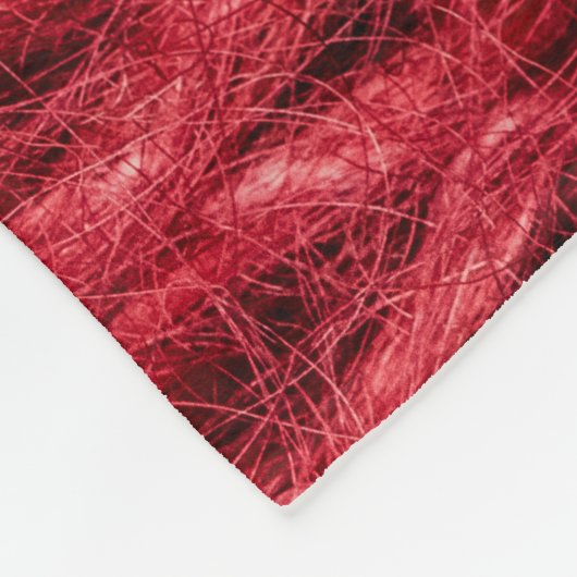 レッドウール:編み物テクスチャ背景。 フリースブランケット (角)