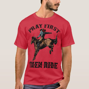 レトロホーシングカウボーイ祈最初に西に乗る Tシャツ