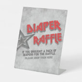 ロック生まれへ – おむつラッフル 台座サイン (正面)