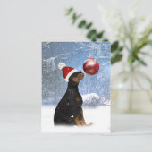 ロットワイラーの子犬が付いている冬休みの郵便はがき シーズンポストカード (スタンド正面)