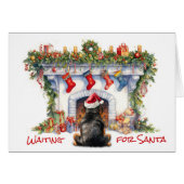 ロットワイラー犬がサンタクリスマス暖炉を待つ (正面横)