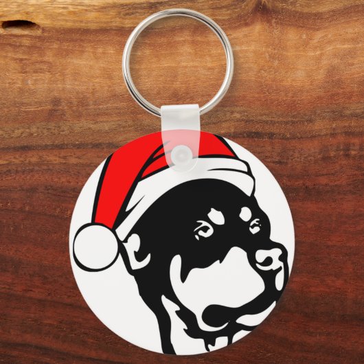 ロットワイラー犬が赤いクリスマスサンタハットを着て キーホルダー (正面)