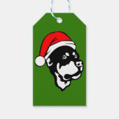 ロットワイラー犬が赤いクリスマスサンタハットを着て ギフトタグ (正面)