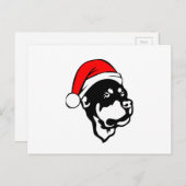 ロットワイラー犬が赤いクリスマスサンタハットを着て シーズンポストカード (正面/裏面)