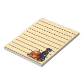 ロットワイラー犬ハロウィンカボチャのそばに座って並んだ ノートパッド (回転)