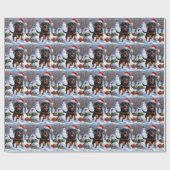 ロットワイラー走のクリスマス帽子と雪の中 ラッピングペーパー (フラット)