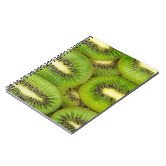 ローズブラウンの新鮮で熟したキウイの果実のスライス，c ノートブック (左側)