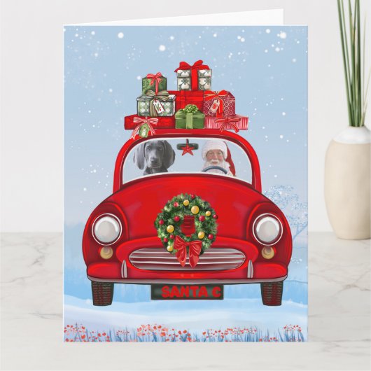 ワイマラナー犬がサンタクロースと一緒に車の中にいる カード (正面)