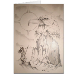 ワシの石の種族の彫像で祈っているインディアン