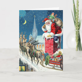ヴィンテージな屋根の上のサンタとソリのクリスマス シーズンカード