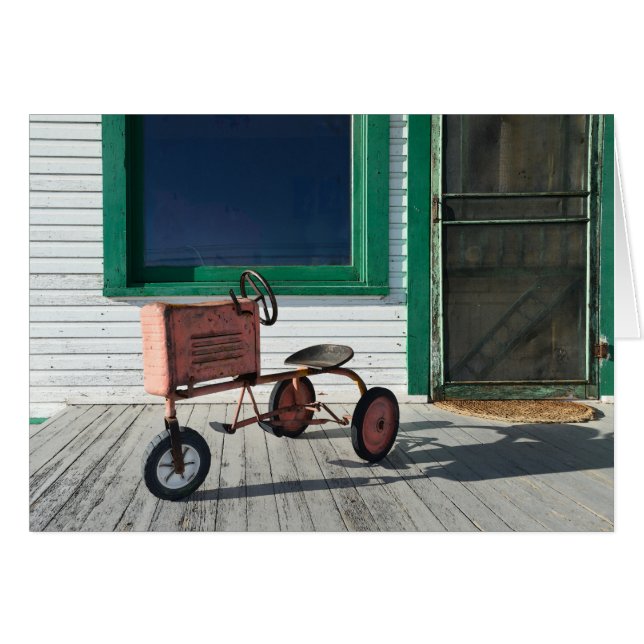 ヴィンテージのおもちゃのトラクター (正面横)