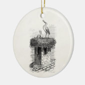 ヴィンテージのこうのとりの鳥の巣の鳥のアンティークのテンプレート セラミックオーナメント (左)