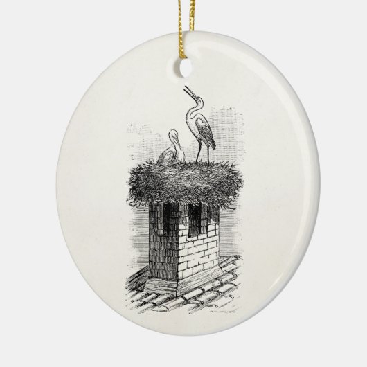 ヴィンテージのこうのとりの鳥の巣の鳥のアンティークのテンプレート セラミックオーナメント (左)