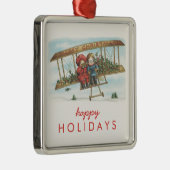 ヴィンテージのクリスマスのヒイラギのかわいい子供の飛行機の休日 メタルオーナメント (右)