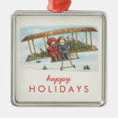 ヴィンテージのクリスマスのヒイラギのかわいい子供の飛行機の休日 メタルオーナメント (正面)